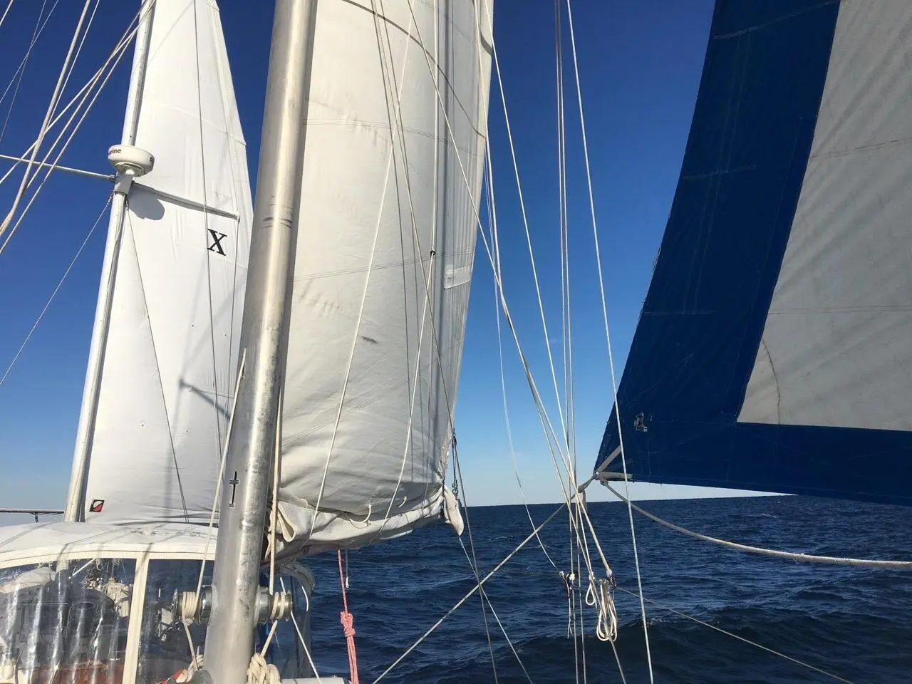 Close view of Tandemeer's sails filled with wind