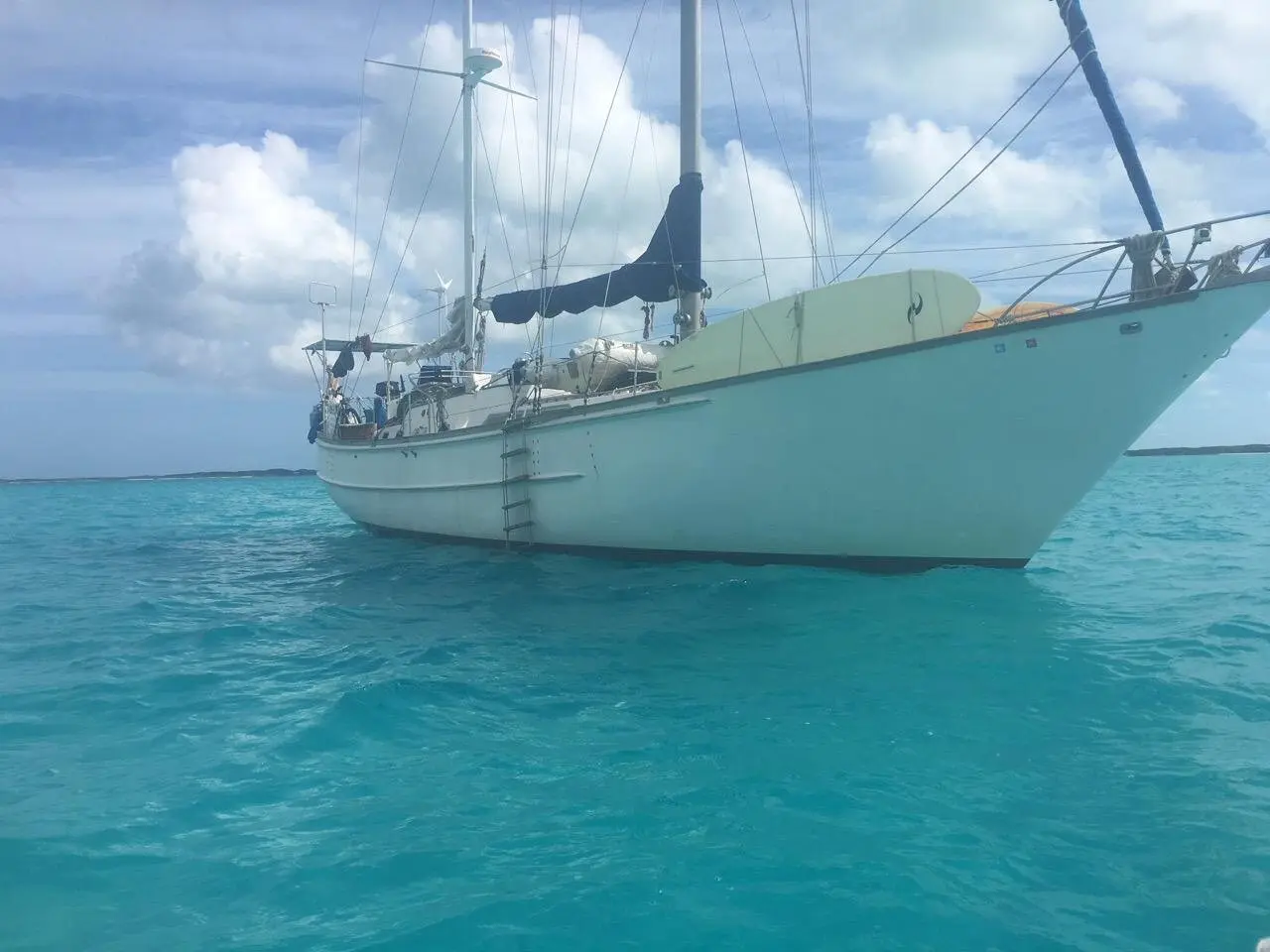 Tandemeer resting at anchor in a calm harbor