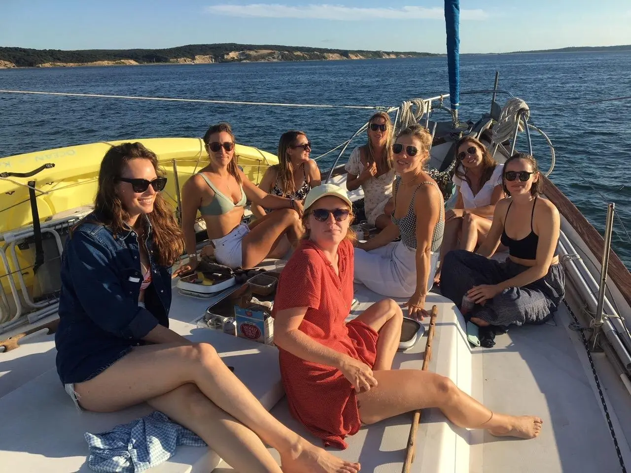 Bachelorette party guests soaking up the sun on the bow