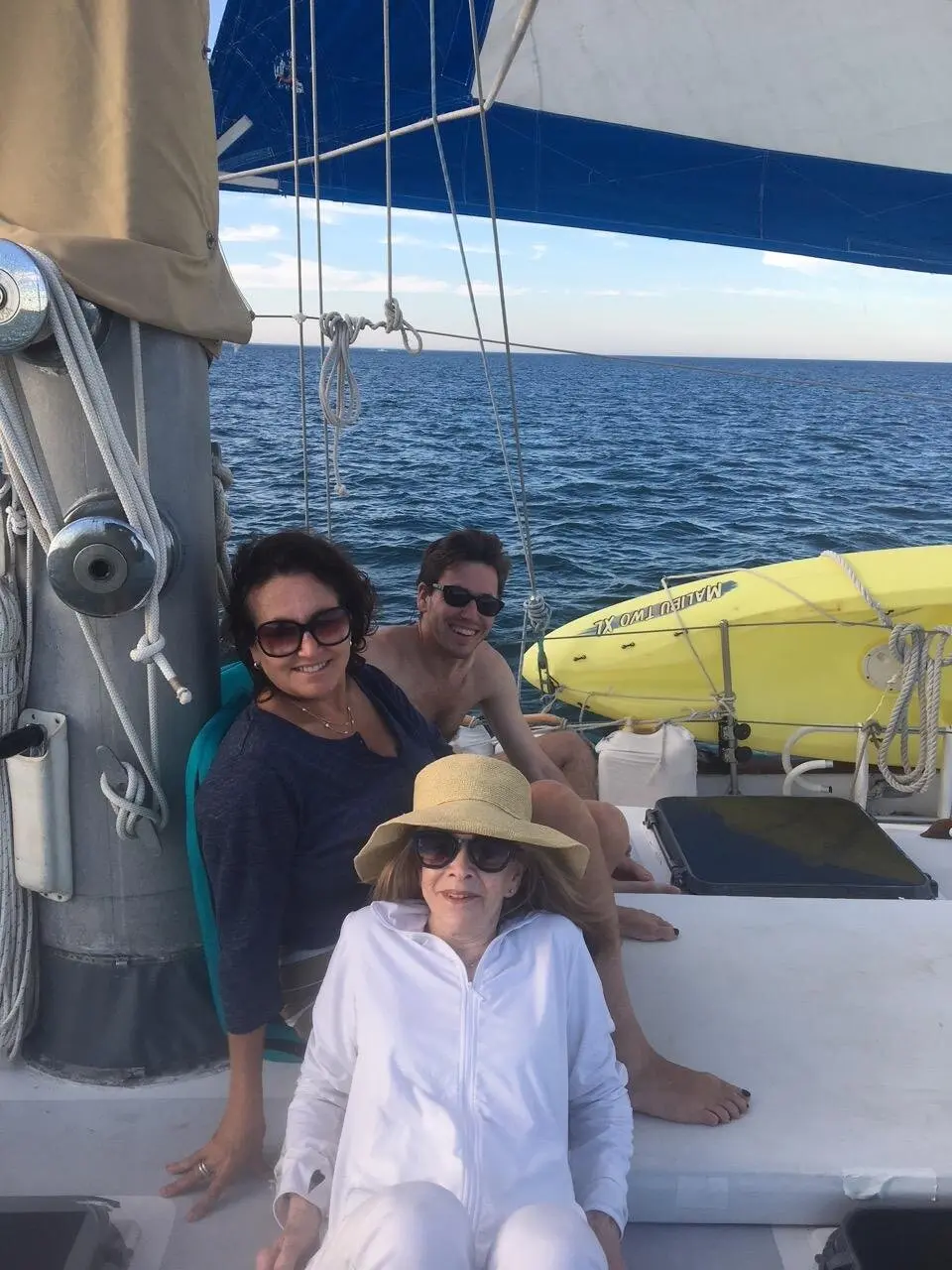 Guest relaxing on deck while sailing