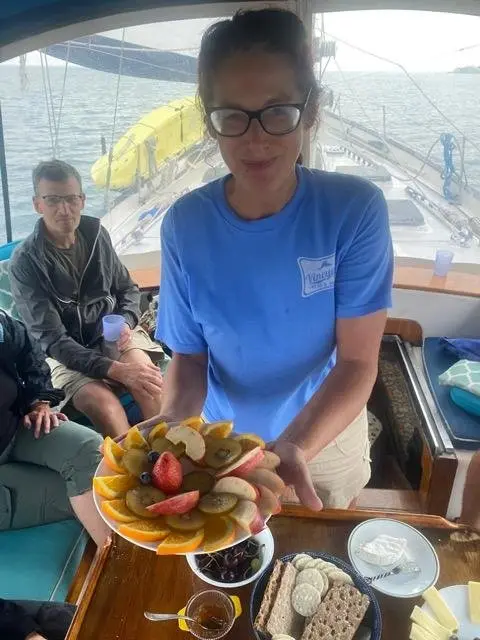 Crew member Elaina serving guests aboard Tandemeer