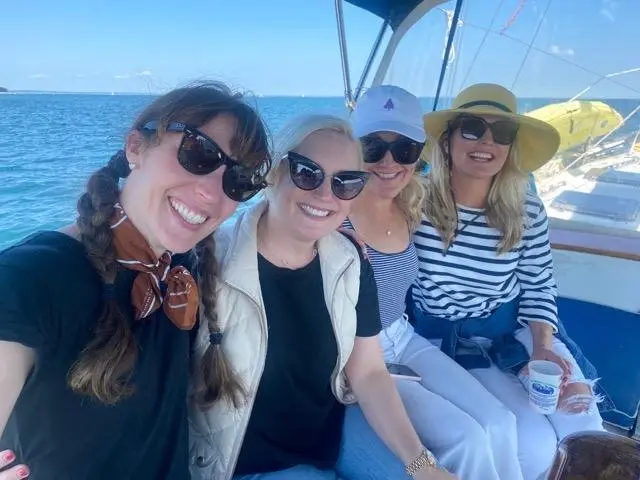 Four guests relaxing together in the cockpit
